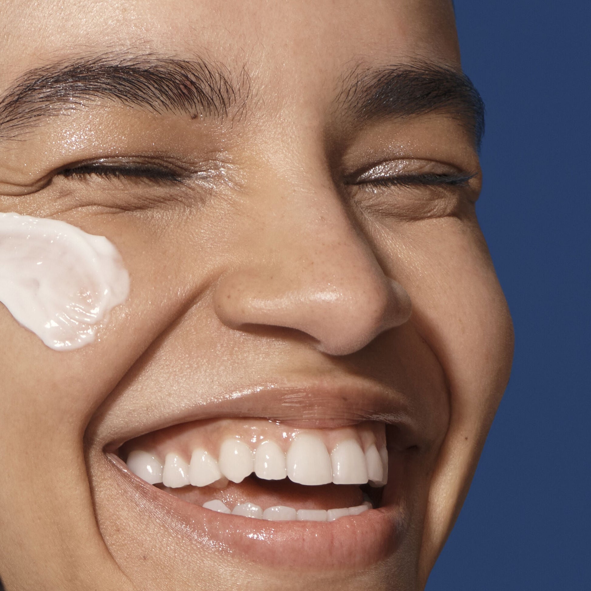 Close-up of a person who has applied  cream to their face  